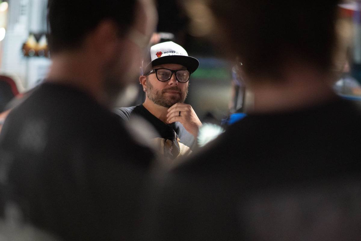 Candid of a crew member framed between two people