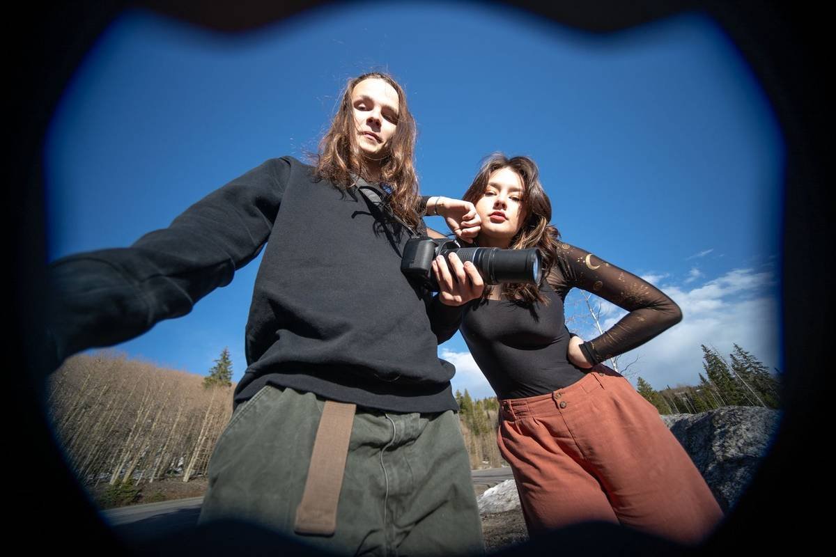 Fisheye portrait of two friends with a camera