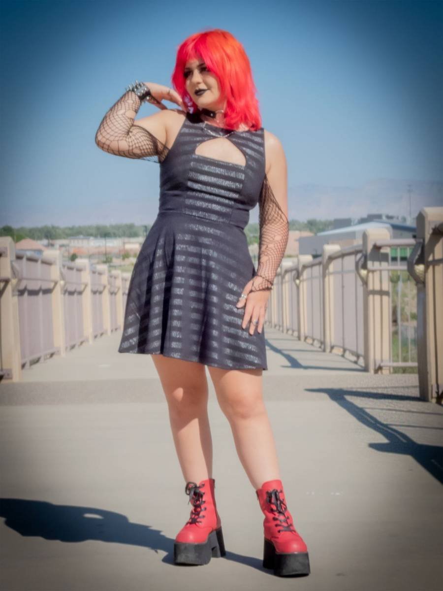 Full-length senior portrait on a bridge