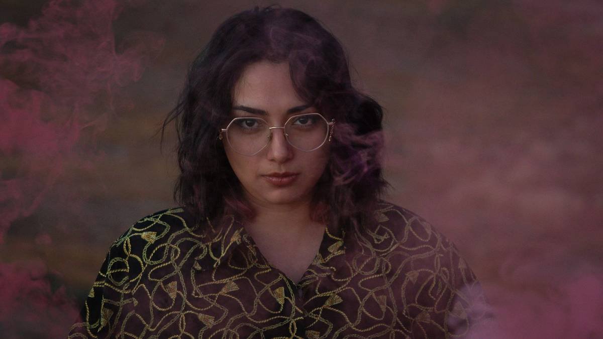 Portrait framed by pink smoke
