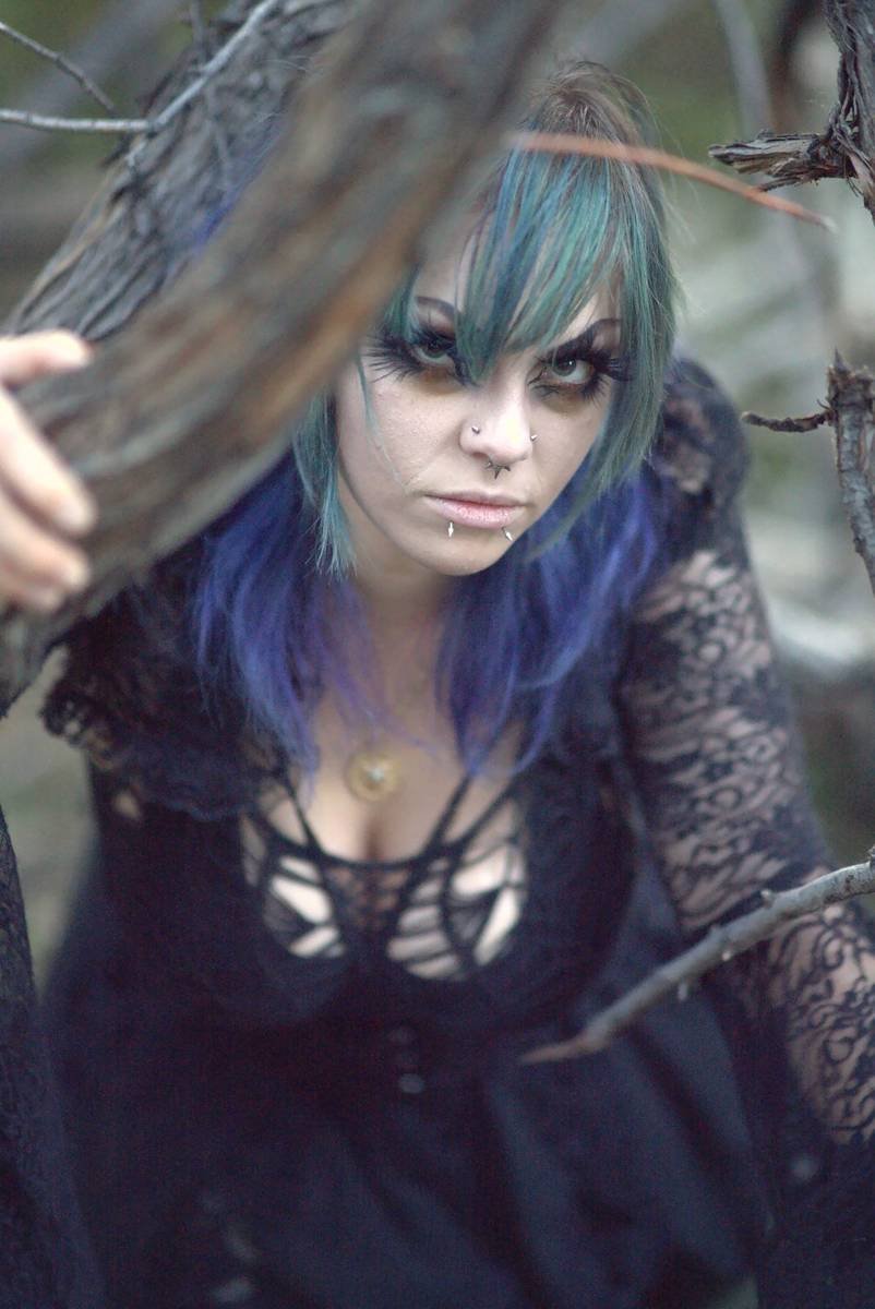 Portrait framed by twisted branches