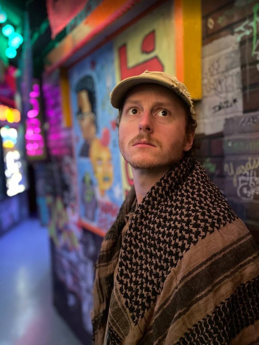 Portrait in a neon-lit graffiti alley