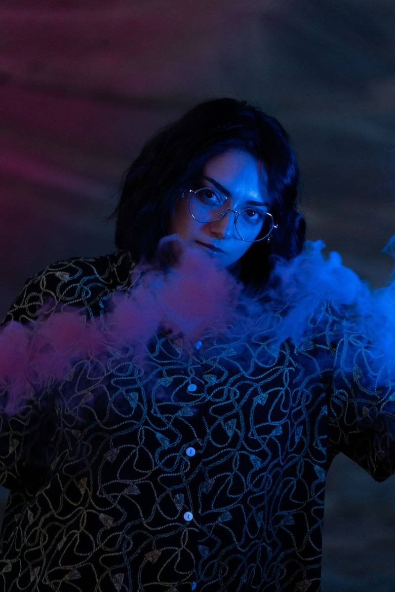 Portrait in violet and blue smoke